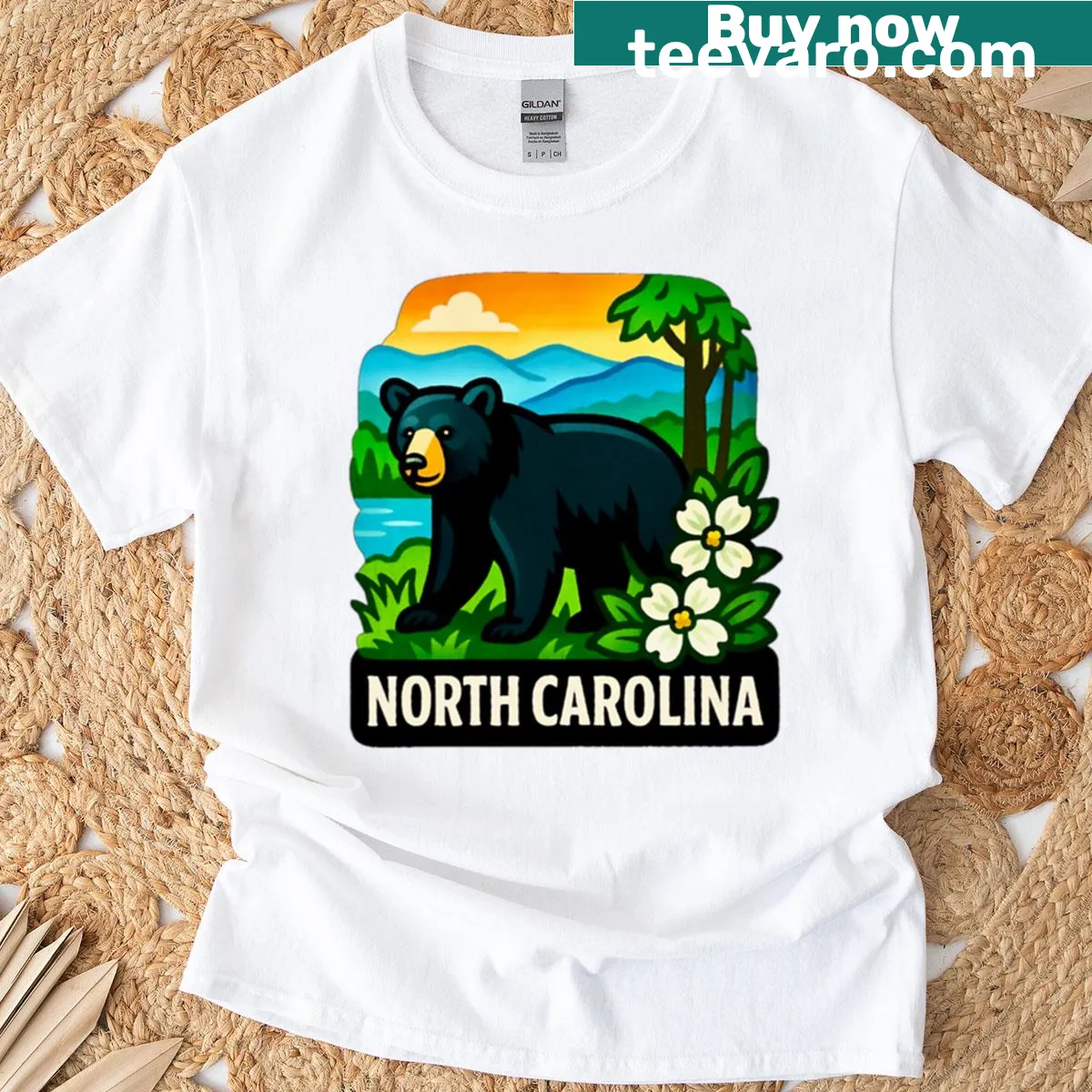 T-shirt depicting a black bear in the Blue Ridge Mountains with dogwood blossoms. — on a men's t-shirt