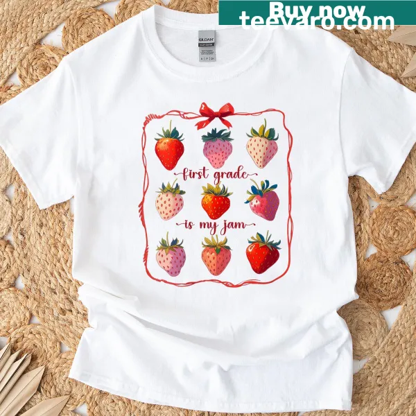 T-shirt with strawberry graphic and 'First Grade Is My Jam' text