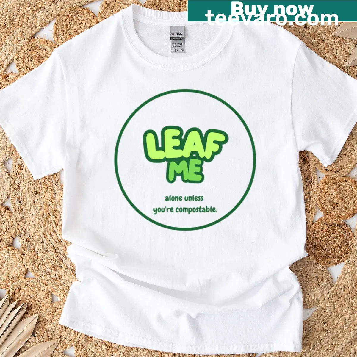 Funny eco-themed T-shirt with 'Leaf Me Alone' text design — on a men's t-shirt