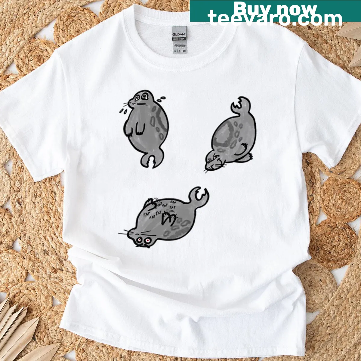 Illustration of playful seals balancing orbs in a whimsical design — on a men's t-shirt