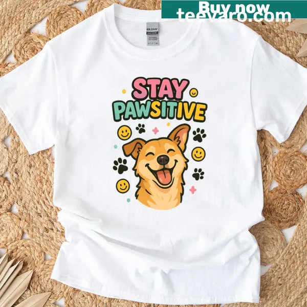 T-shirt with 'Stay Pawsitive' text and playful paw prints