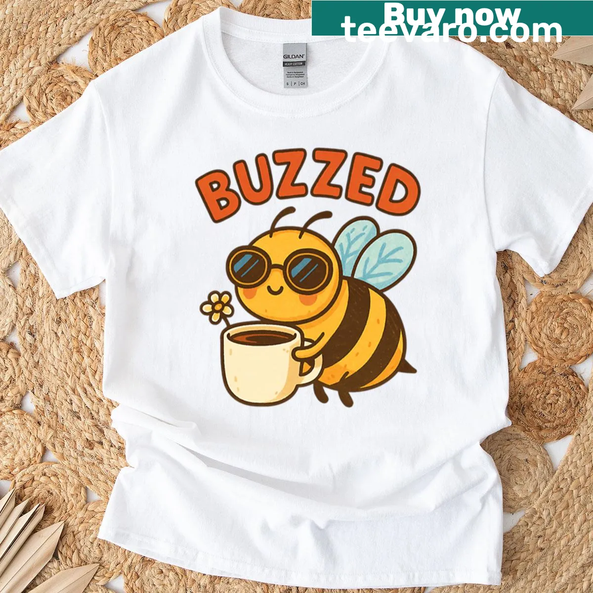 T-shirt featuring a cute cartoon bee enjoying coffee with a pun — on a men's t-shirt