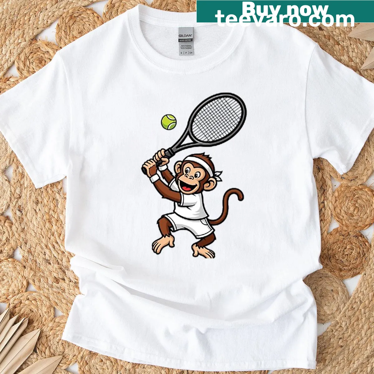 Cartoon monkey playing tennis graphic on an oversized t-shirt — on a men's t-shirt