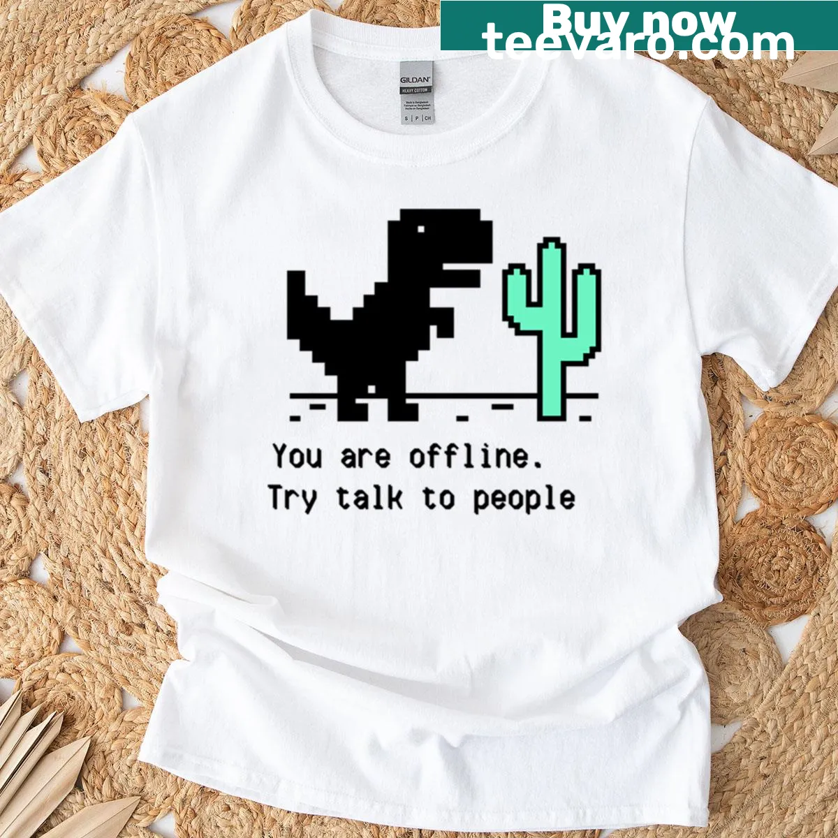 Retro pixel art dinosaur and cactus graphic t-shirt — on a men's t-shirt