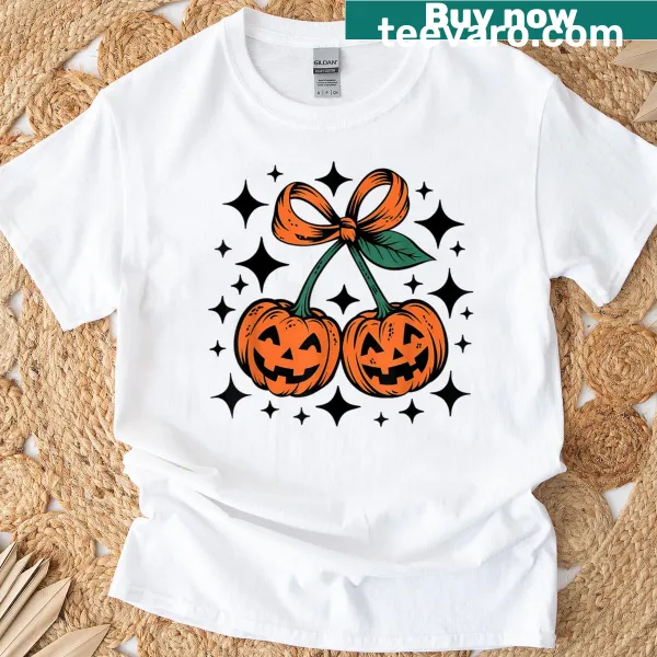 Retro Halloween t-shirt with pumpkin, cherry motifs, and a girly bow