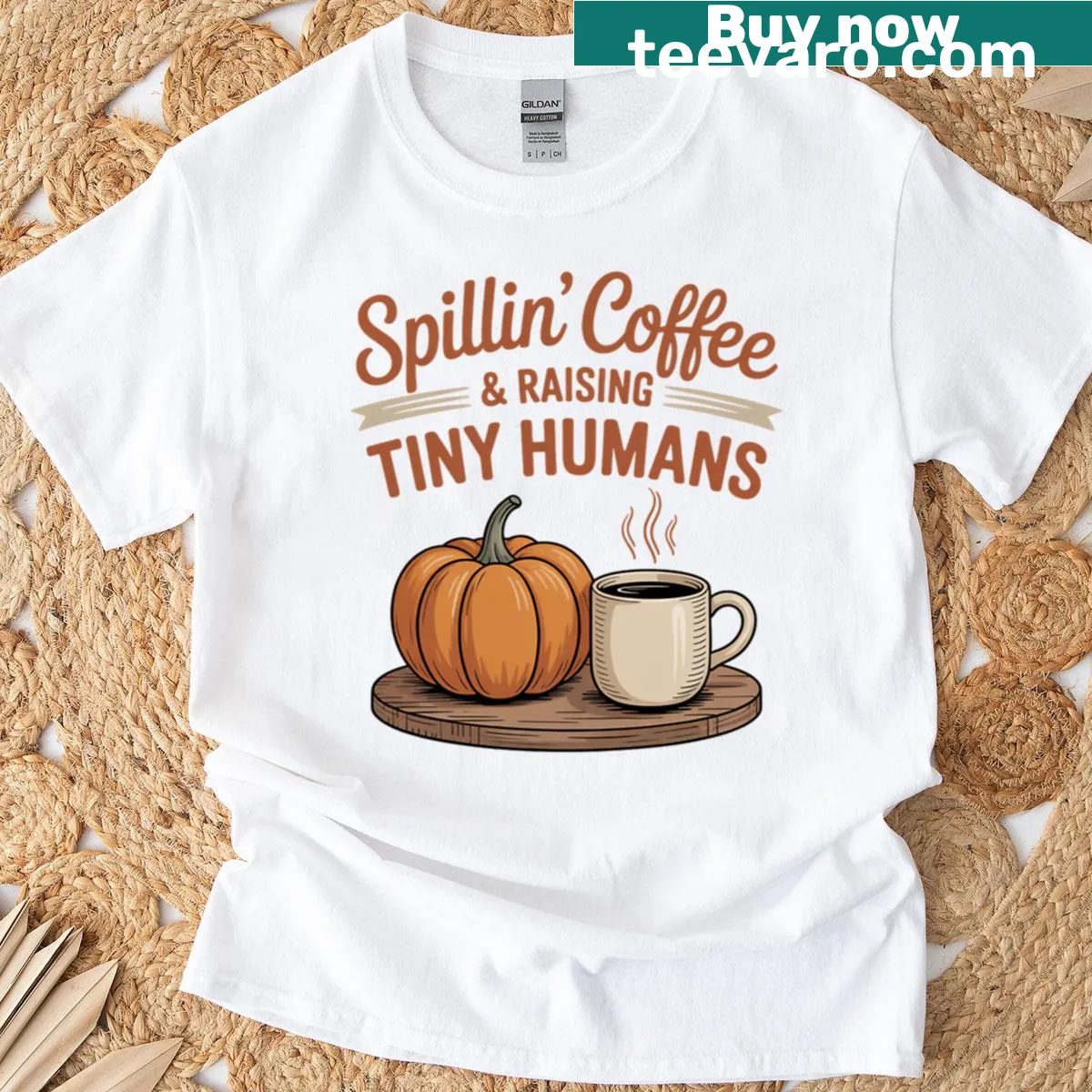 Text design stating 'Spillin Coffee Raising Tiny Humans' on a t-shirt — on a men's t-shirt