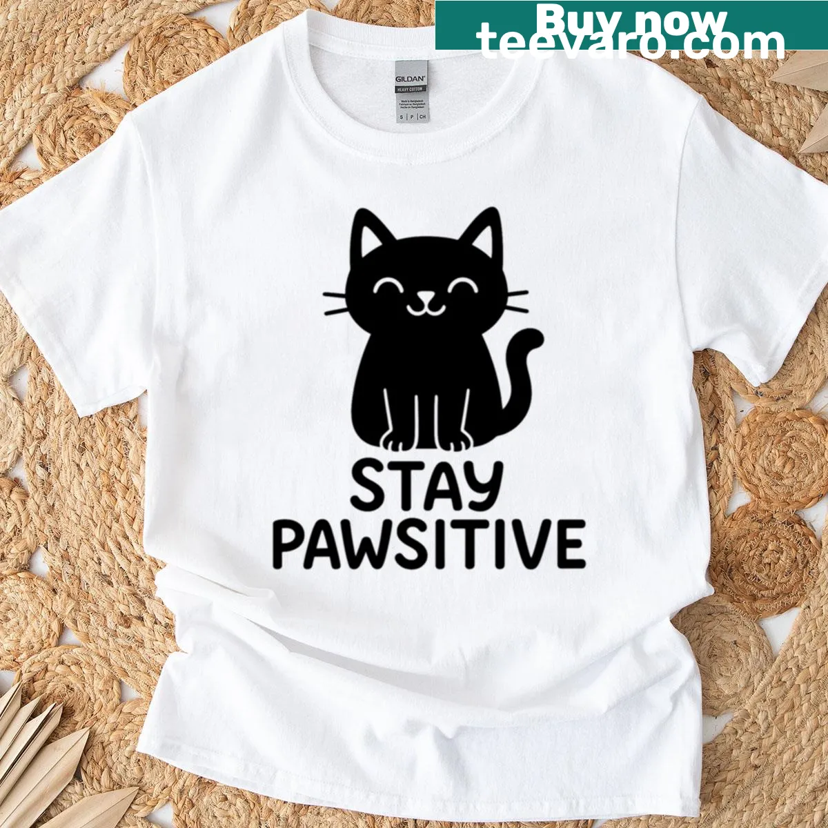 Minimalist T-shirt with a black cat illustration and positive message — on a men's t-shirt