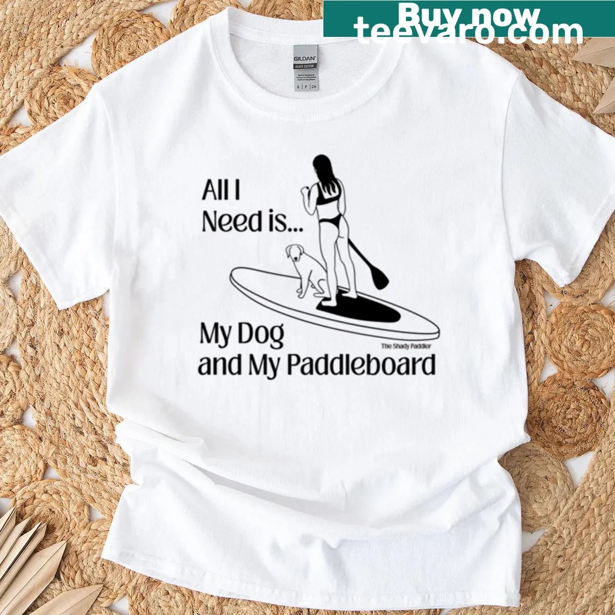 Playful t-shirt with paddleboarder and dog illustration — on a men's t-shirt