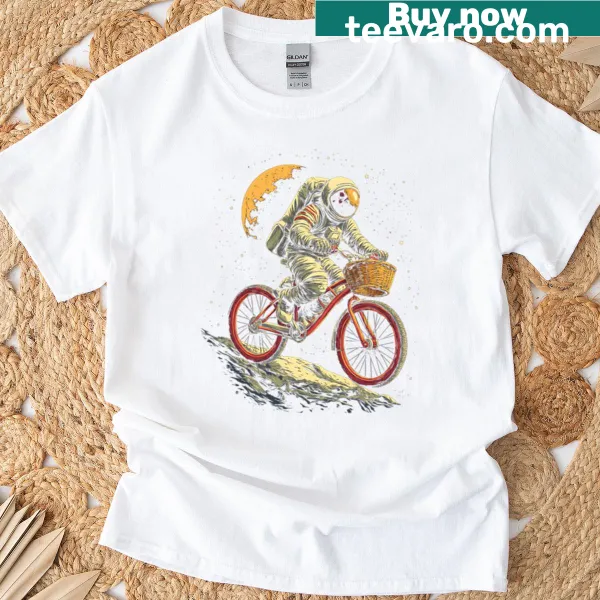 Whimsical astronaut riding a bike in space design on a t-shirt