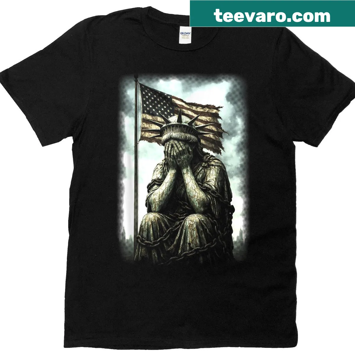 Illustrative T-shirt featuring a crying Statue of Liberty in chains. — on a men's t-shirt