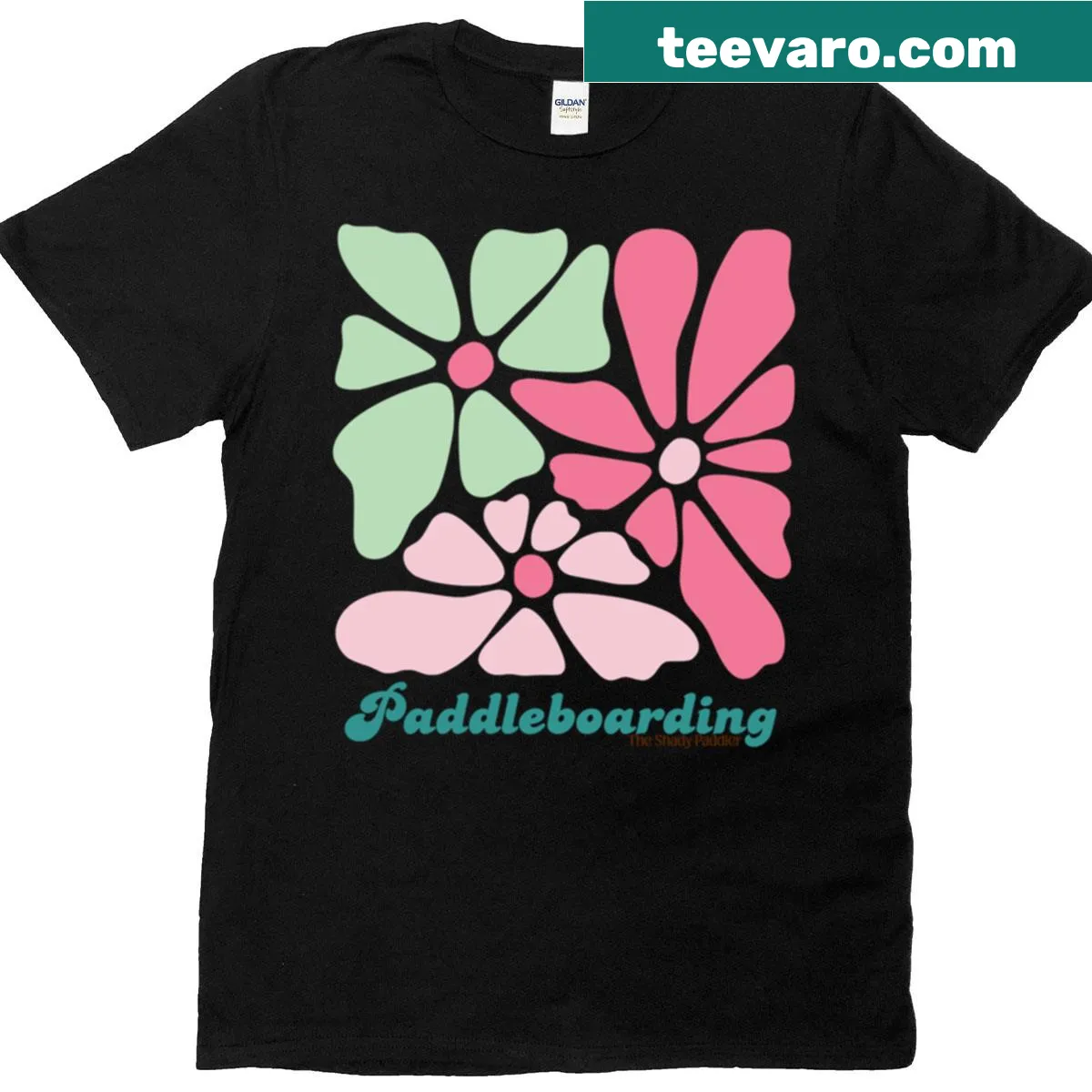 Retro floral design paddleboarding t-shirt featuring aquatic themes — on a men's t-shirt