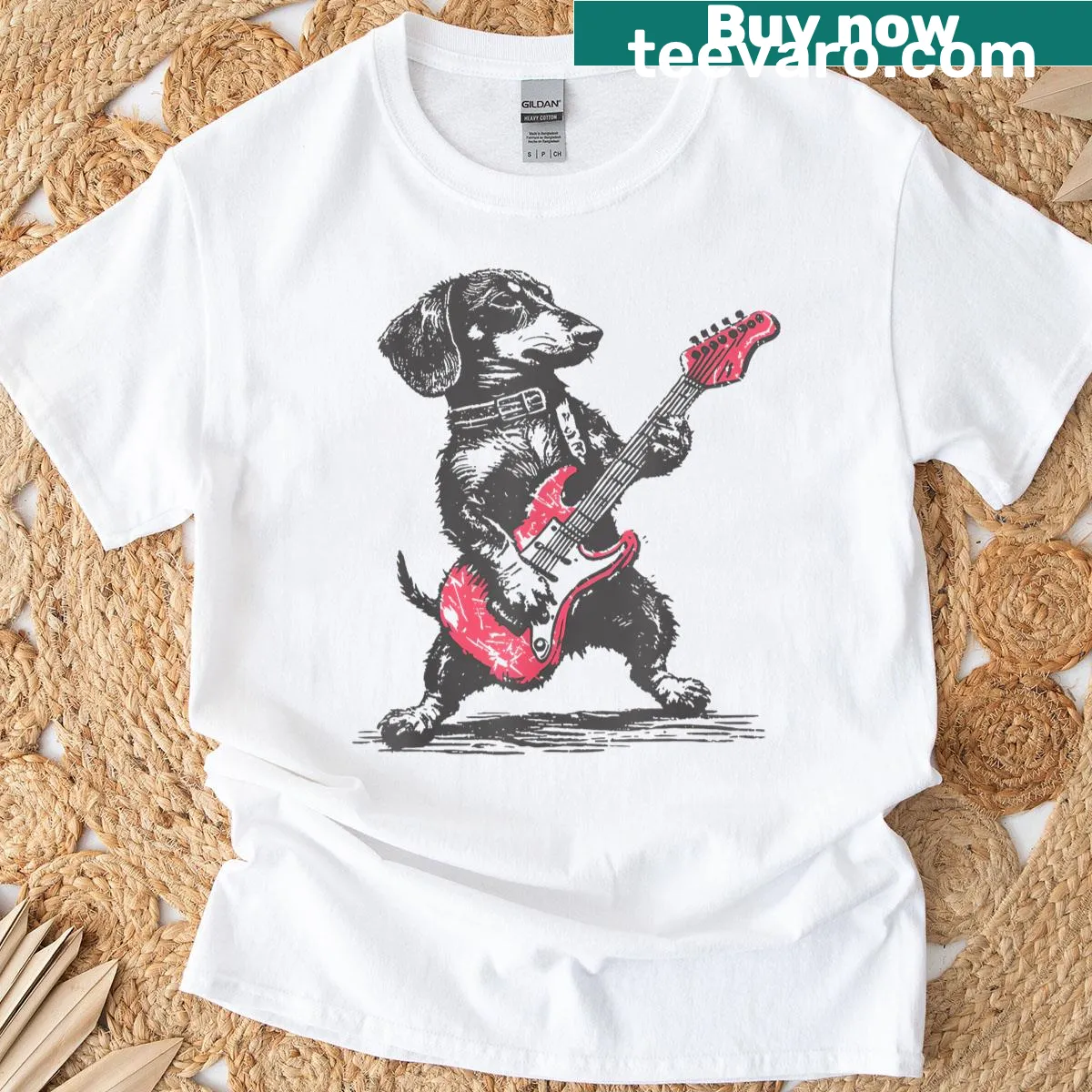 Vintage-style t-shirt featuring a dachshund playing guitar in a playful design. — on a men's t-shirt