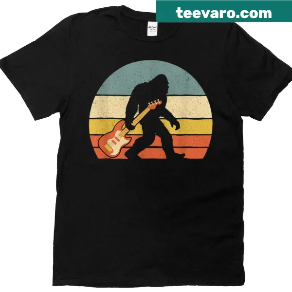 Retro t-shirt featuring Bigfoot playing electric guitar against a sunset