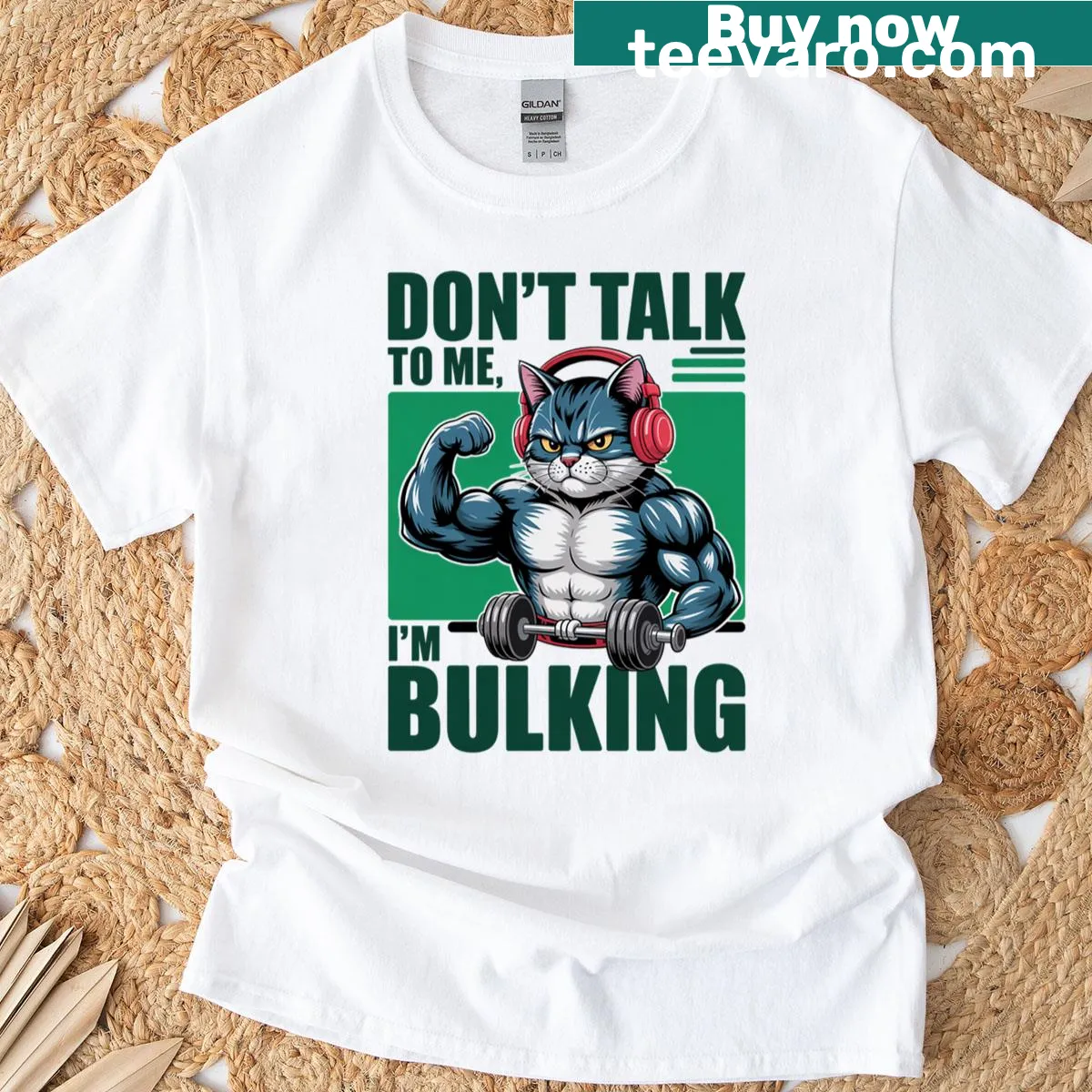 Humorous cat lifting weights graphic T-shirt — on a men's t-shirt