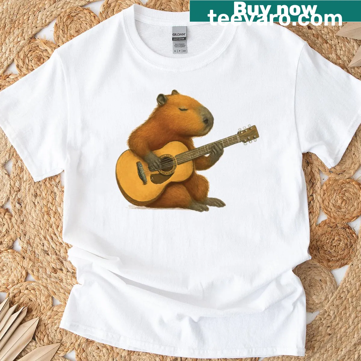 Adorable capybara playing guitar graphic T-shirt — on a men's t-shirt