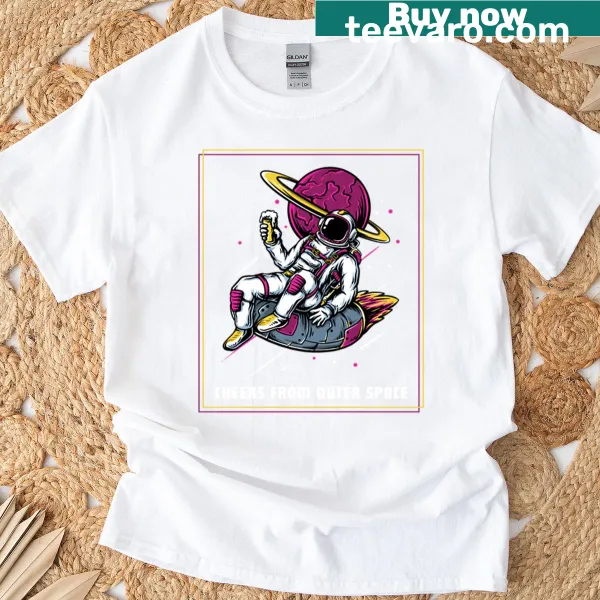Oversized T-shirt featuring a graphic spaceship and the phrase 'Cheers From Outer Space'