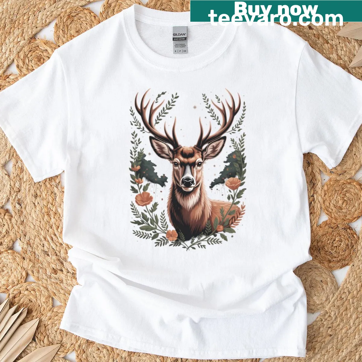 Illustrated T-shirt featuring a deer portrait with floral accents — on a men's t-shirt