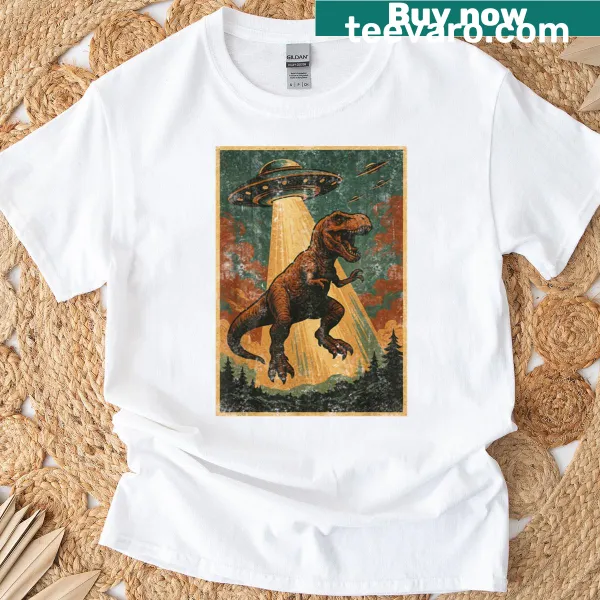 Cartoon dinosaur being abducted by a UFO on a t-shirt