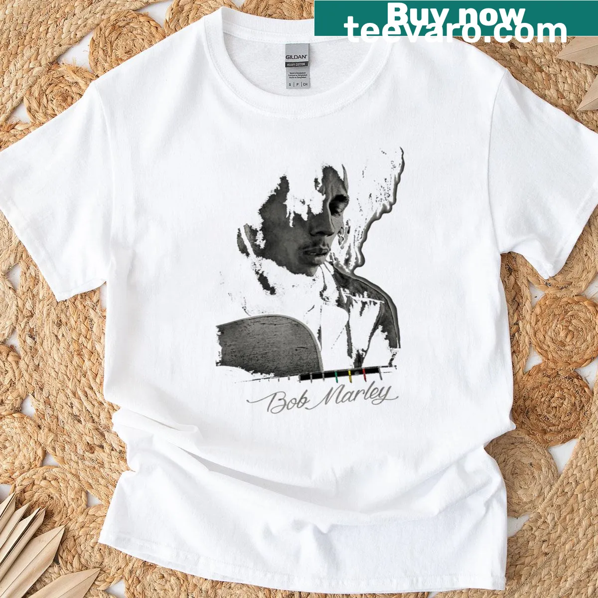 Bob Marley Catch A Fire T-shirt featuring guitar illustration — on a men's t-shirt