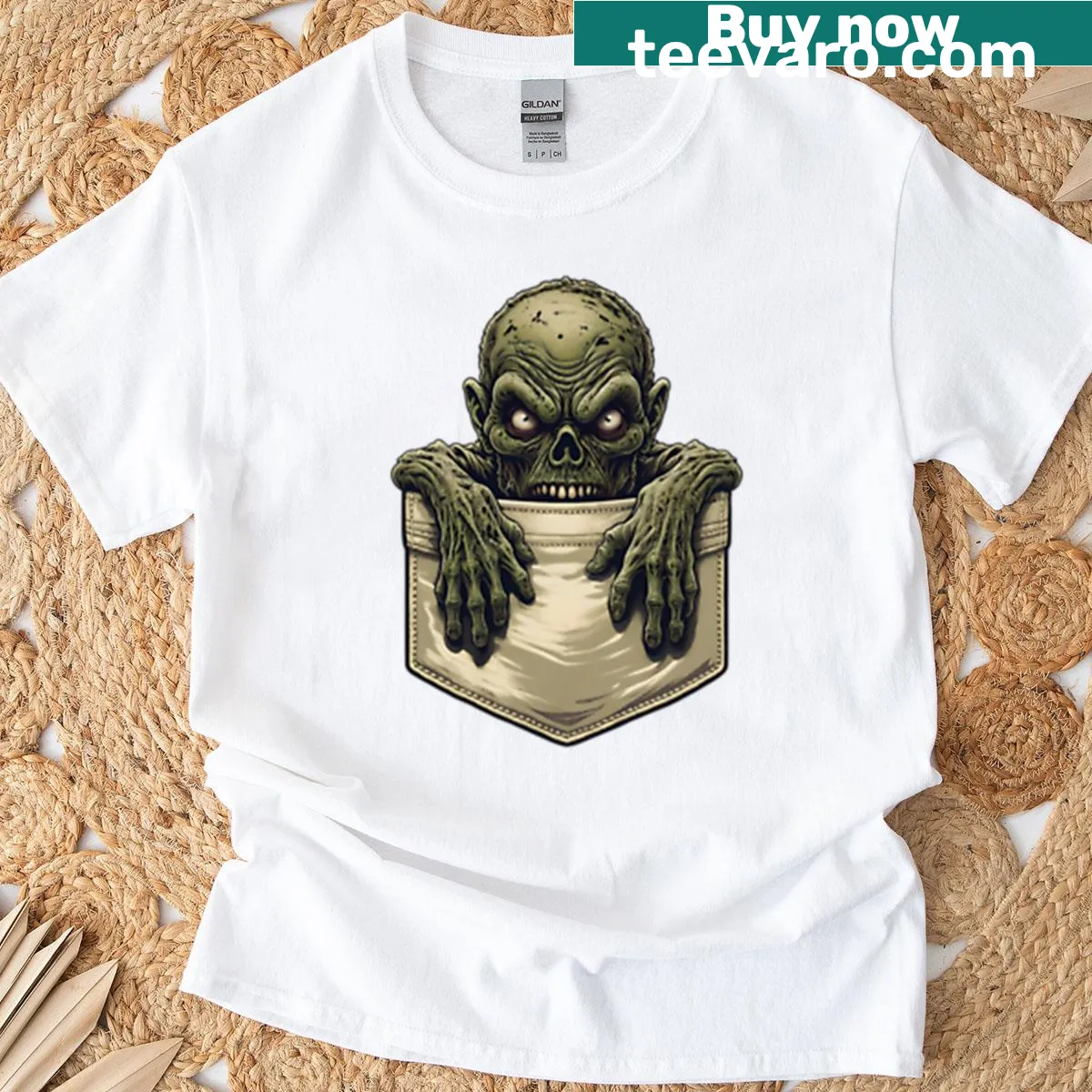 Graphic of a small zombie popping out of a pocket on a T-shirt. — on a men's t-shirt