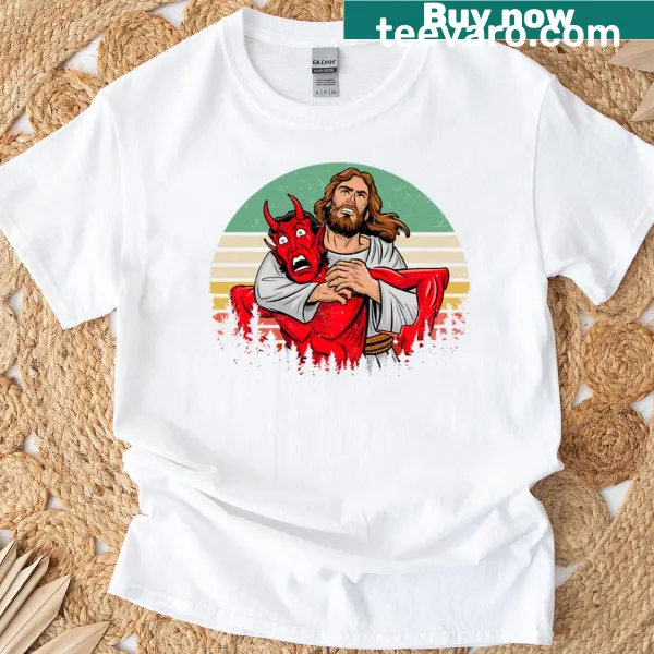 T-shirt depicting Jesus wrestling Satan, symbolizing the battle of good vs evil.