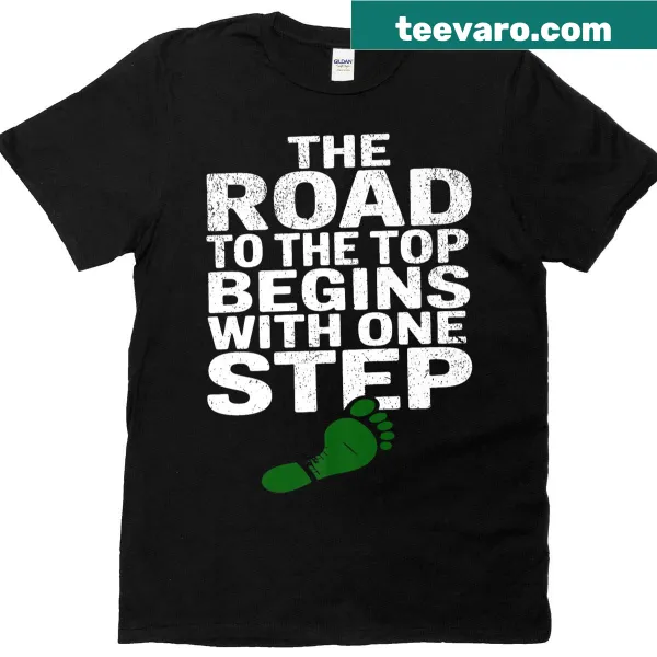 Motivational phrase 'The Road To The Top Begins With One Step' on a T-shirt