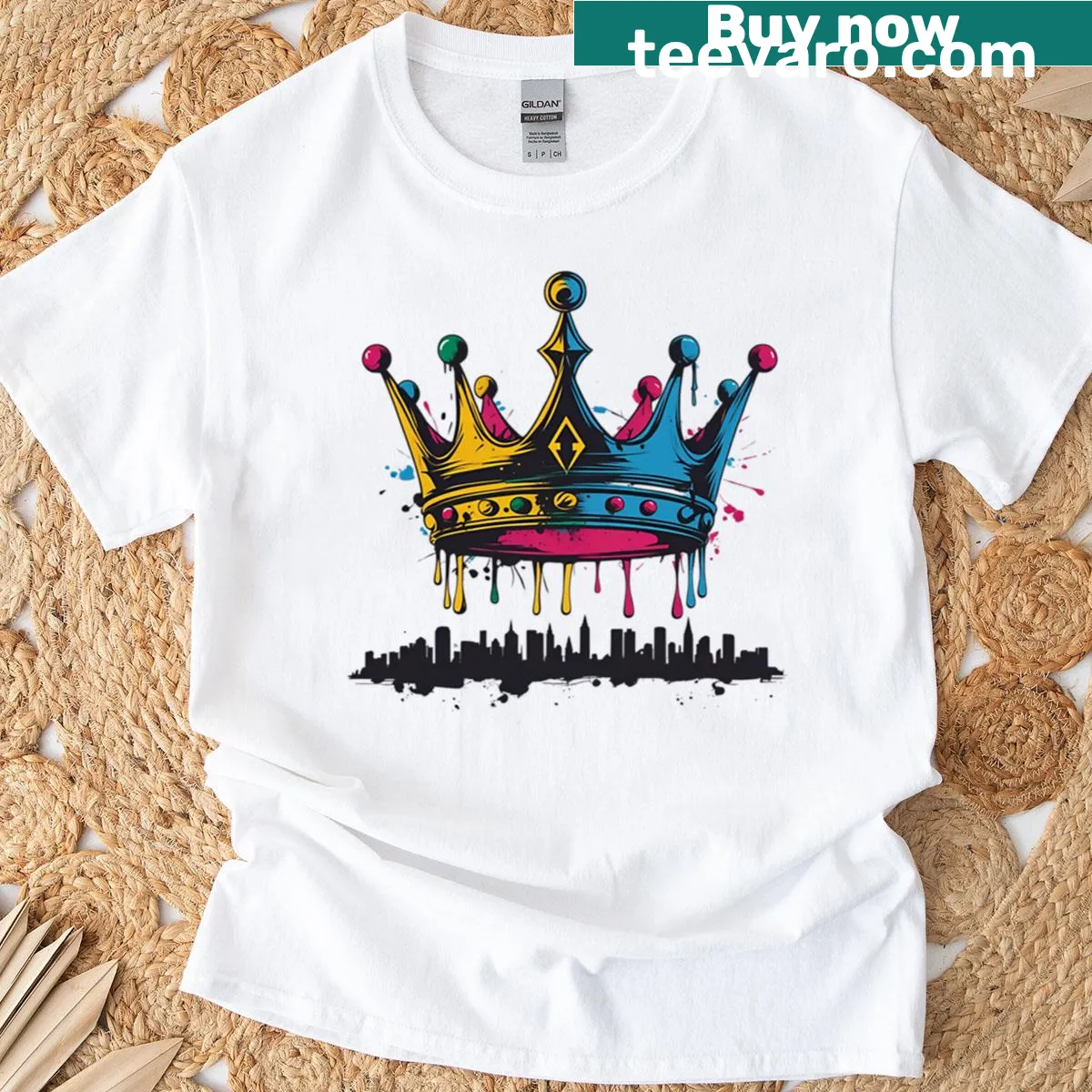 Graphic T-shirt with a dripping crown over a cityscape — on a men's t-shirt