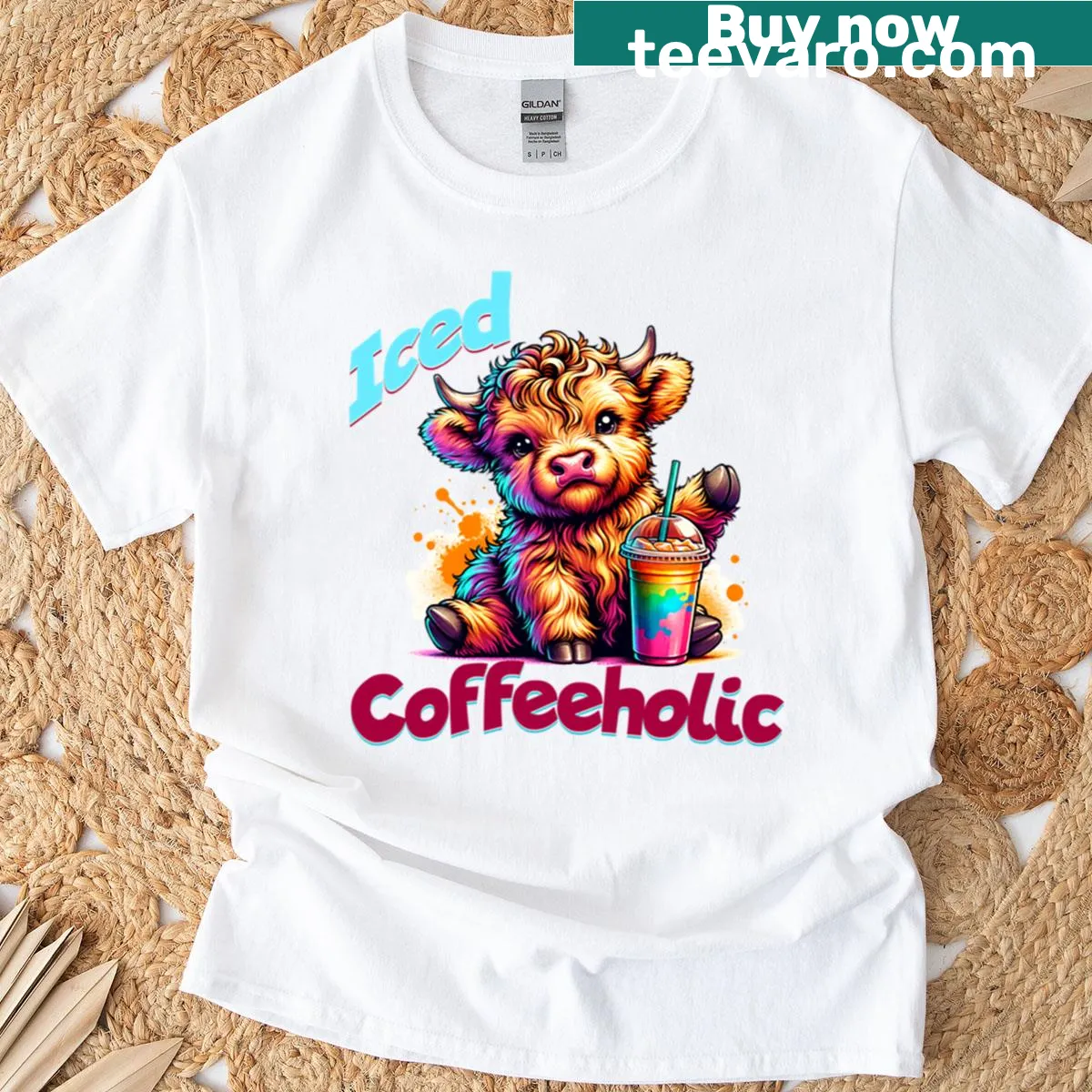 Cute Highland cow holding iced coffee on T-shirt — on a men's t-shirt
