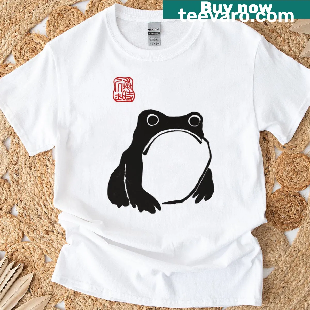 Illustrated T-shirt featuring a grumpy frog toad in a woodblock print style. — on a men's t-shirt