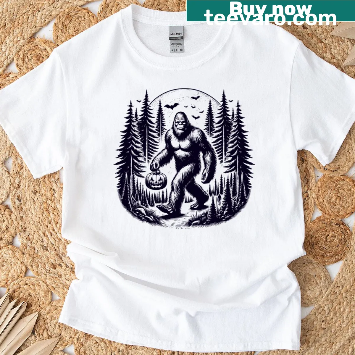 Playful Halloween t-shirt with Bigfoot and pumpkin illustrations — on a men's t-shirt