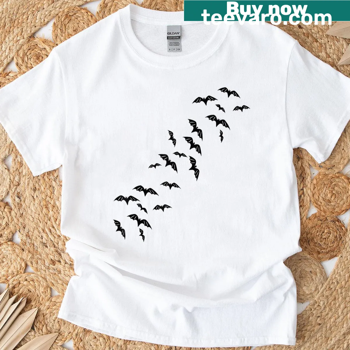 Vintage Halloween T-shirt featuring a spooky mansion and bats — on a men's t-shirt