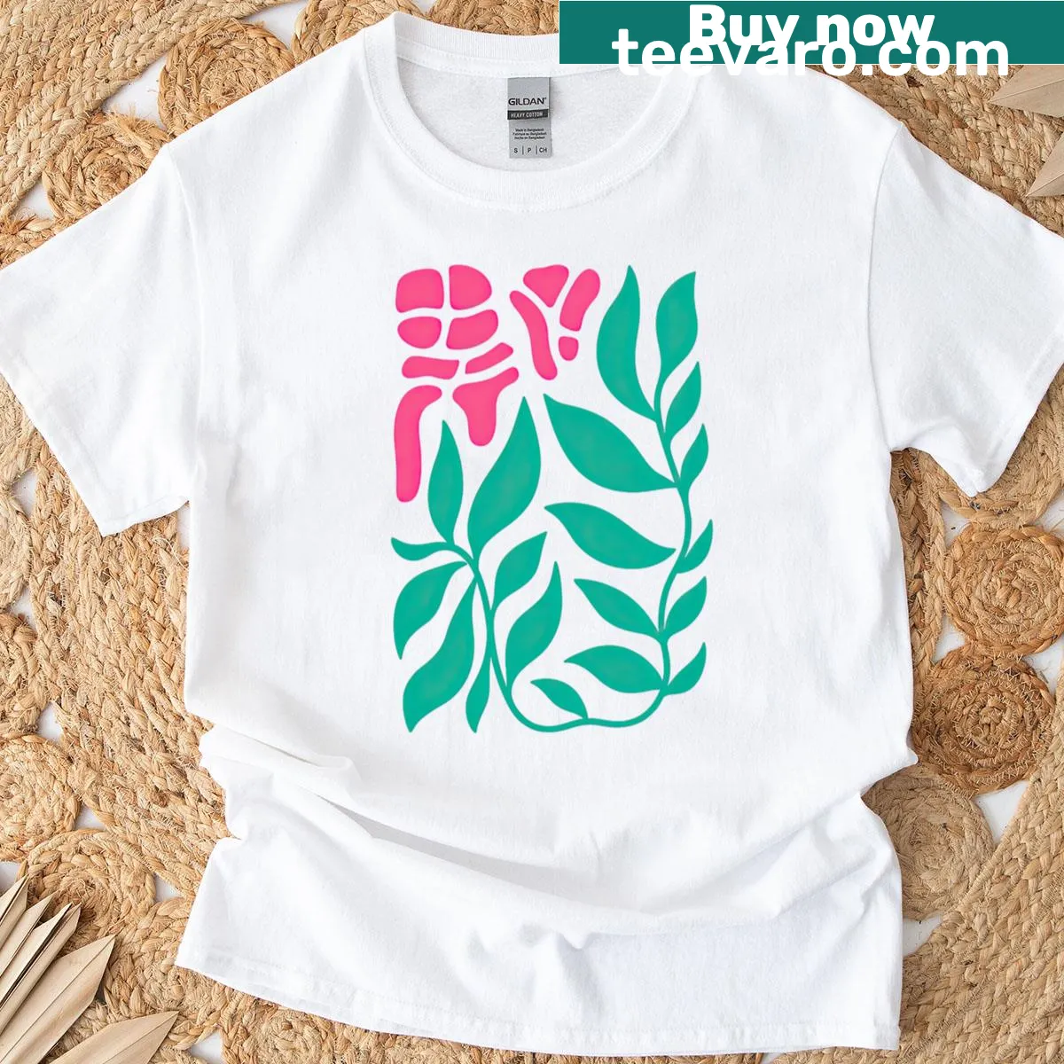 Tropical T-shirt with abstract green leaves and pink coral design — on a men's t-shirt