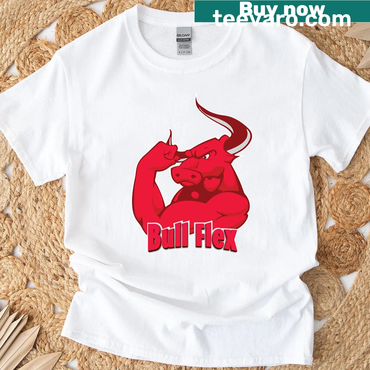 Playful bull flexing muscles graphic T-shirt for fitness enthusiasts — on a men's t-shirt