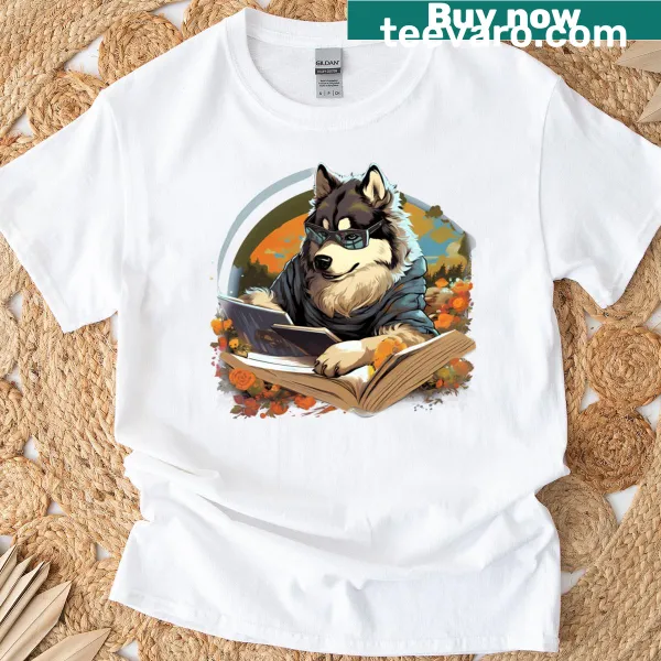 T-shirt featuring an Alaskan Malamute dog reading a book outdoors