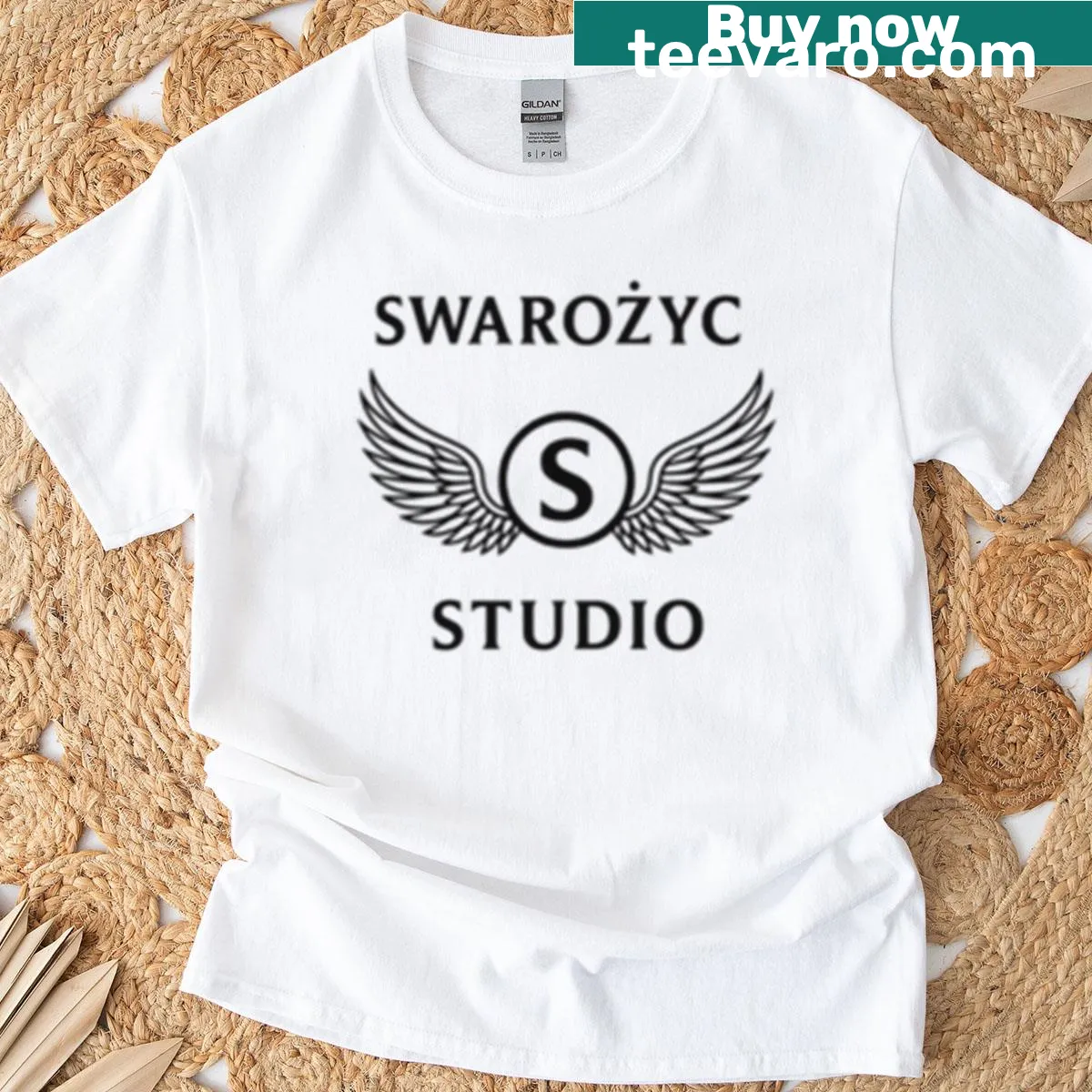 Oversized T-shirt featuring a bold emblem design in black and white. — on a men's t-shirt