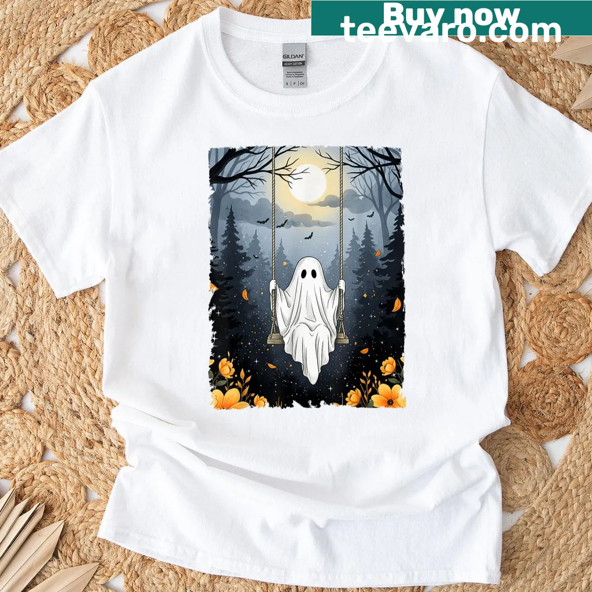 Vintage Halloween t-shirt with a ghost swinging in a forest with floral accents — on a men's t-shirt