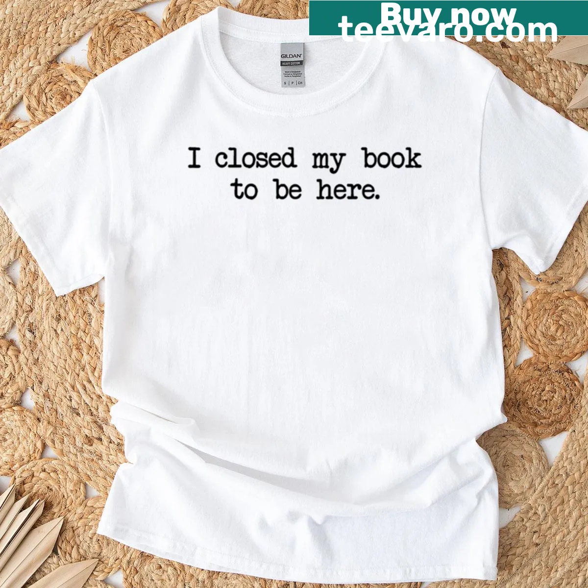T-shirt featuring the phrase "I Closed My Book To Be Here" in simple typography. — on a men's t-shirt
