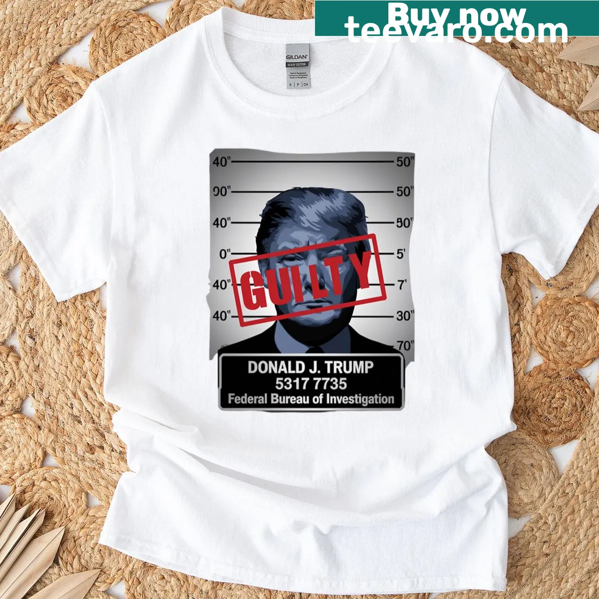 Political T-shirt featuring a mugshot and text about Donald Trump — on a men's t-shirt