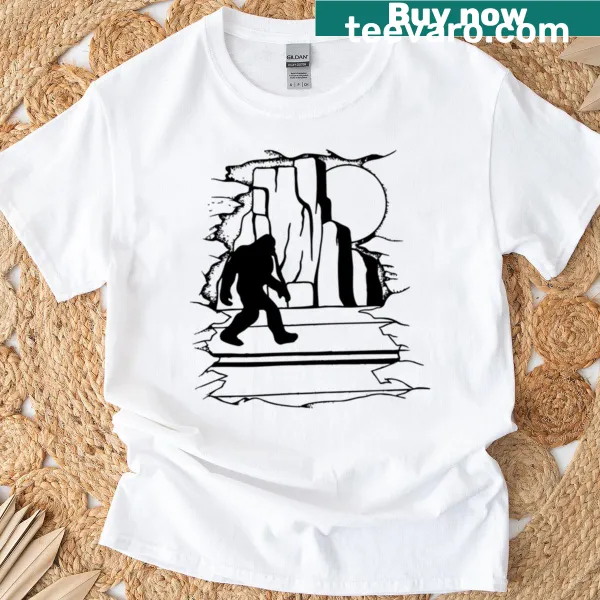 Bigfoot driving on an open road graphic T-shirt
