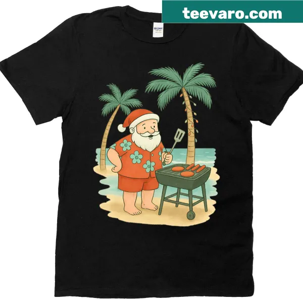Santa grilling burgers at the beach in a fun Christmas in July t-shirt