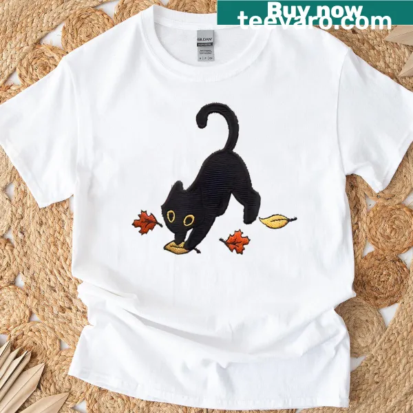 T-shirt with a cute black cat illustration pouncing in leaves