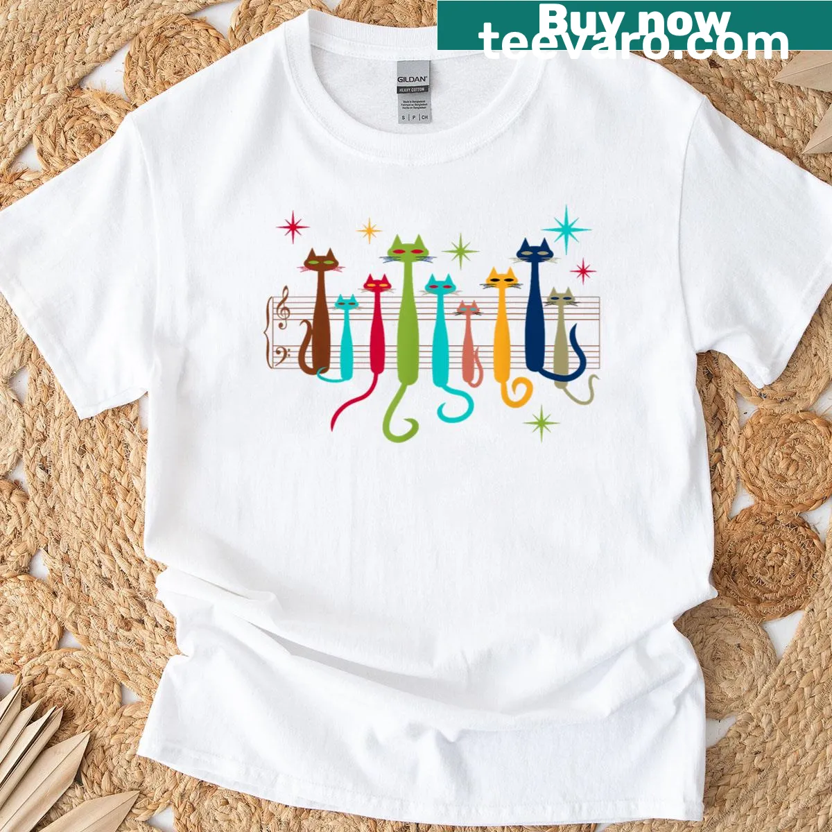 Artistic graphic T-shirt with cute cats on a music sheet design — on a men's t-shirt