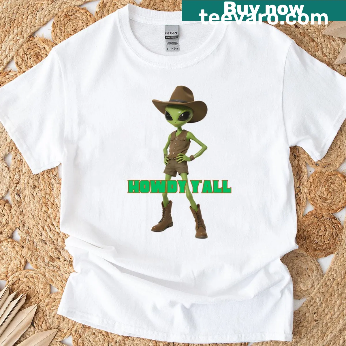 Cartoon alien cowboy t-shirt featuring a green alien in cowboy attire — on a men's t-shirt