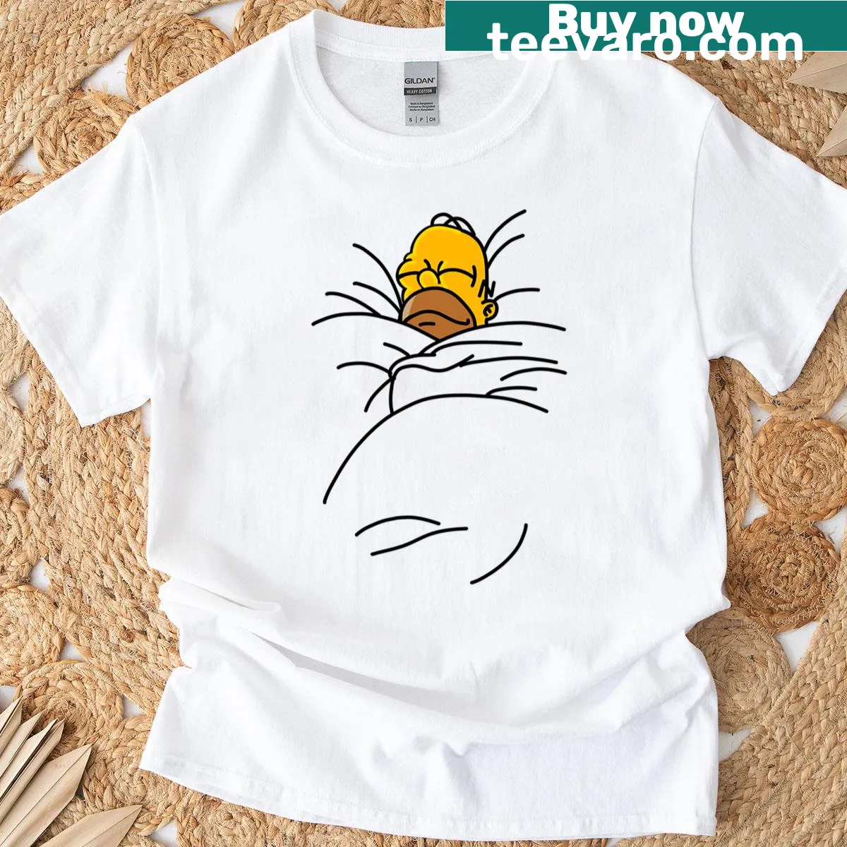 Oversized t-shirt featuring a cartoon graphic of Homer Simpson in bed — on a men's t-shirt