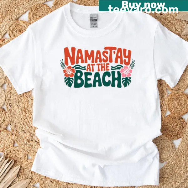 Playful 'Namastay At The Beach' graphic on a yoga humor t-shirt
