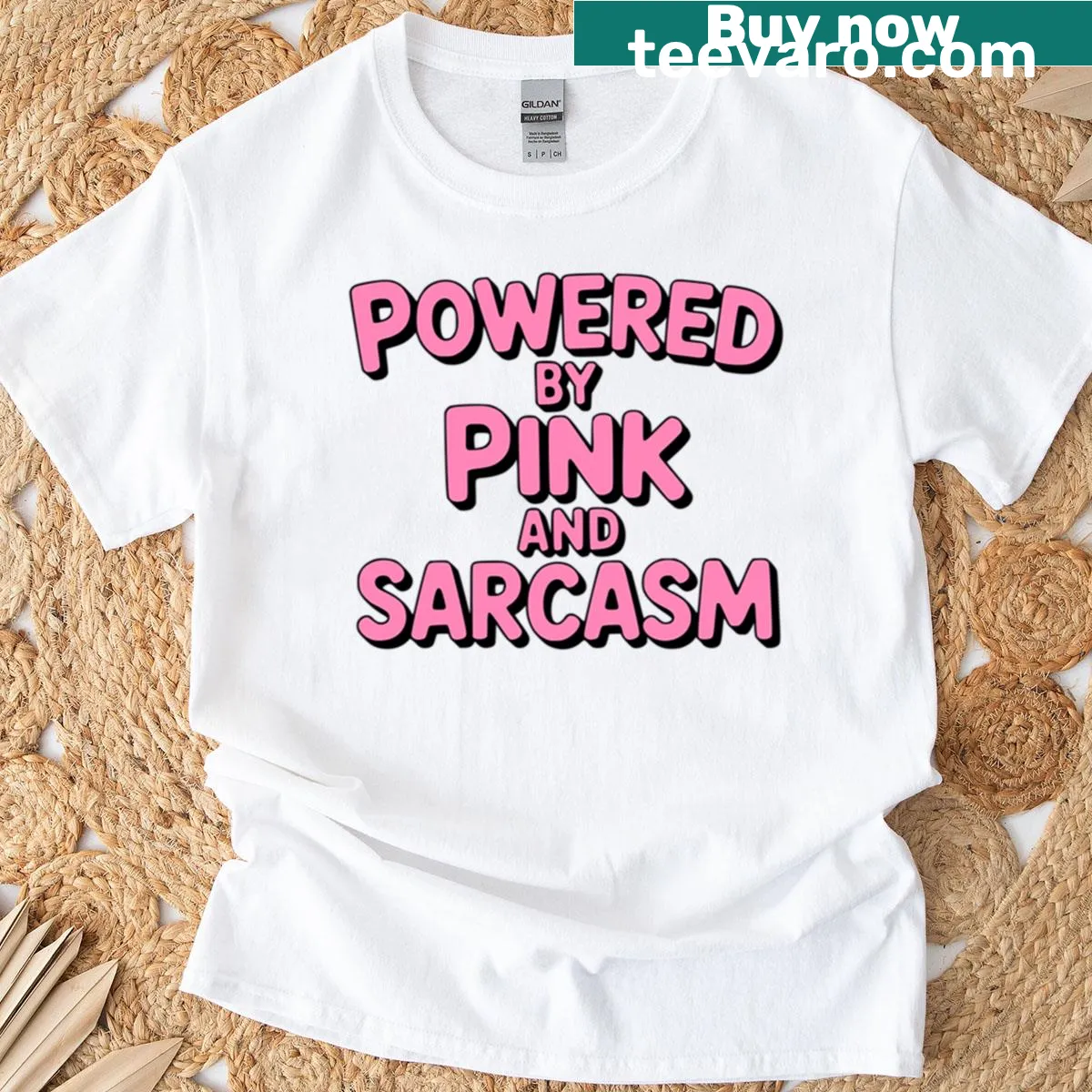 Pink T-shirt with the text 'Powered By Pink And Sarcasm' in playful typography. — on a men's t-shirt
