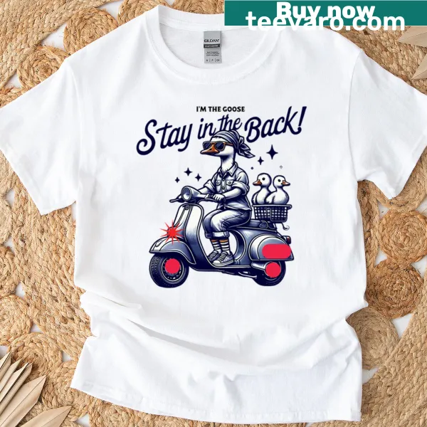 Whimsical T-shirt featuring a goose on a scooter with ducklings