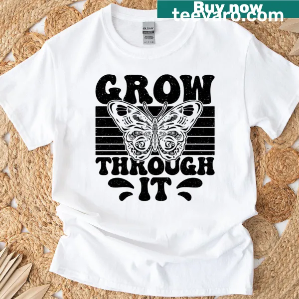 Oversized t-shirt featuring a butterfly and 'Grow Through It' phrase for nature lovers.