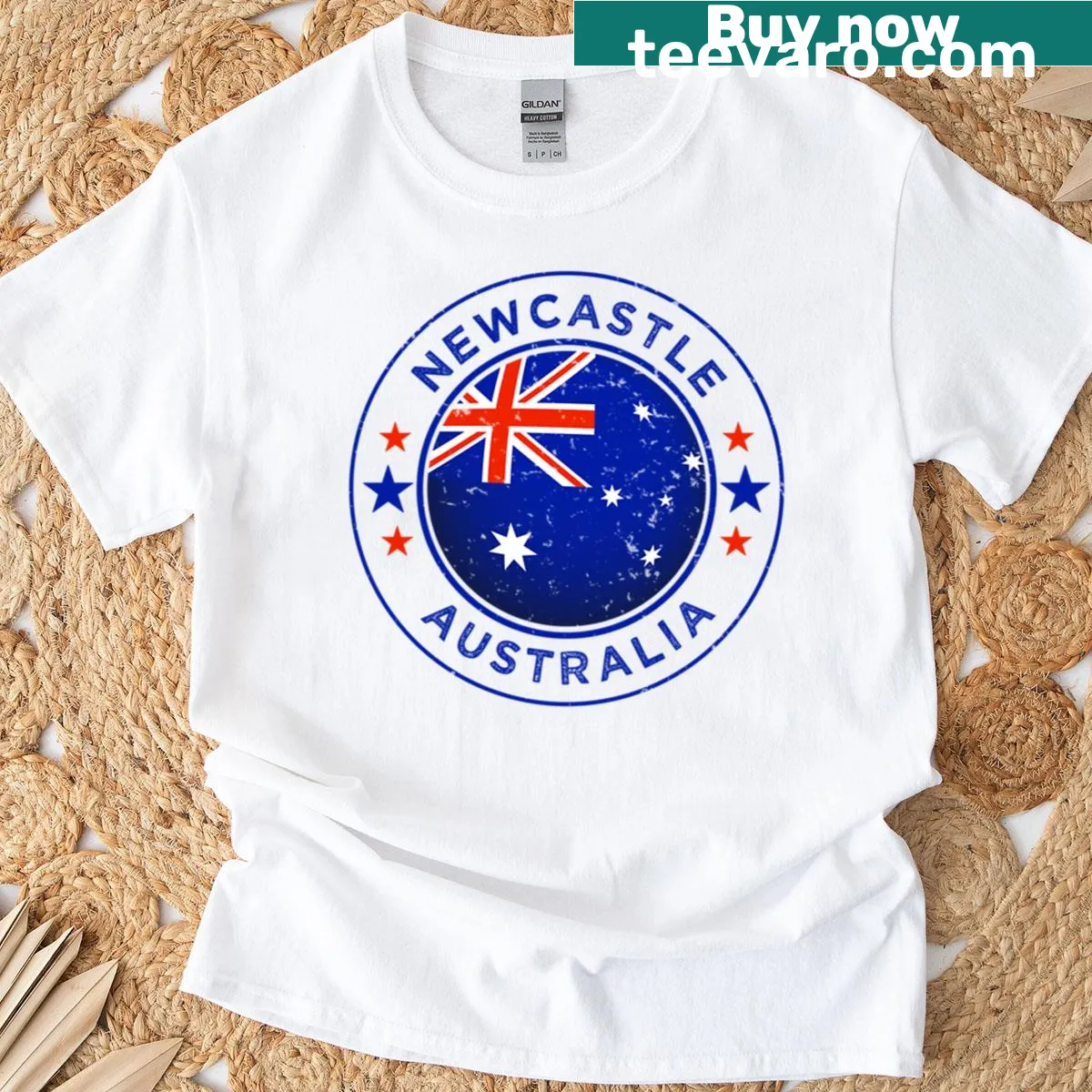 Vintage badge emblem of Newcastle Australia on an oversized t-shirt. — on a men's t-shirt
