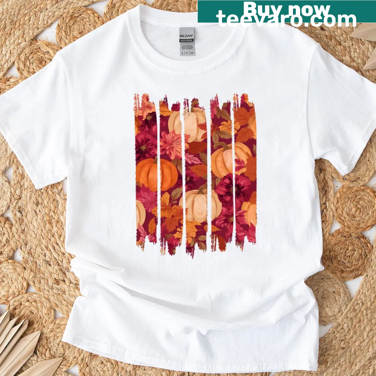 Autumn-themed T-shirt with pumpkin and floral brush pattern — on a men's t-shirt